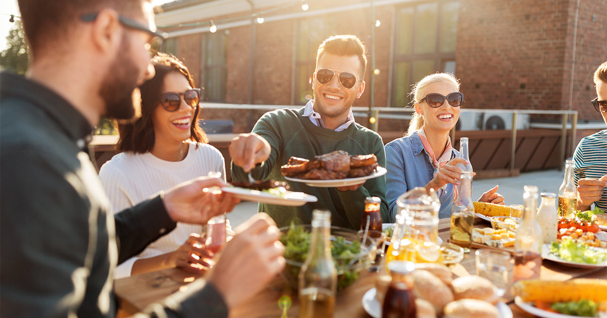 Friends enjoying bbq at a dinner party